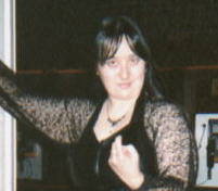 Me in a black lace blouse and skirt